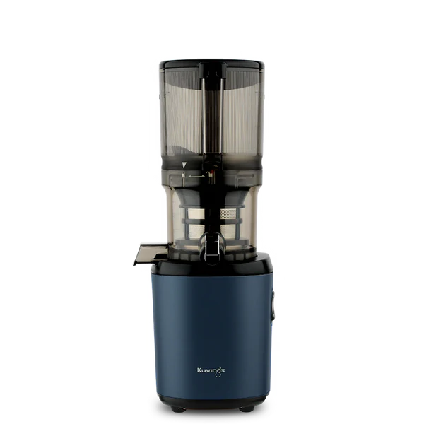 Straight-on studio product shot of a navy blue Kuvings AUTO6 whole slow juicer with its transparent grey mega-hopper container attached, isolated against a transparent grid background.