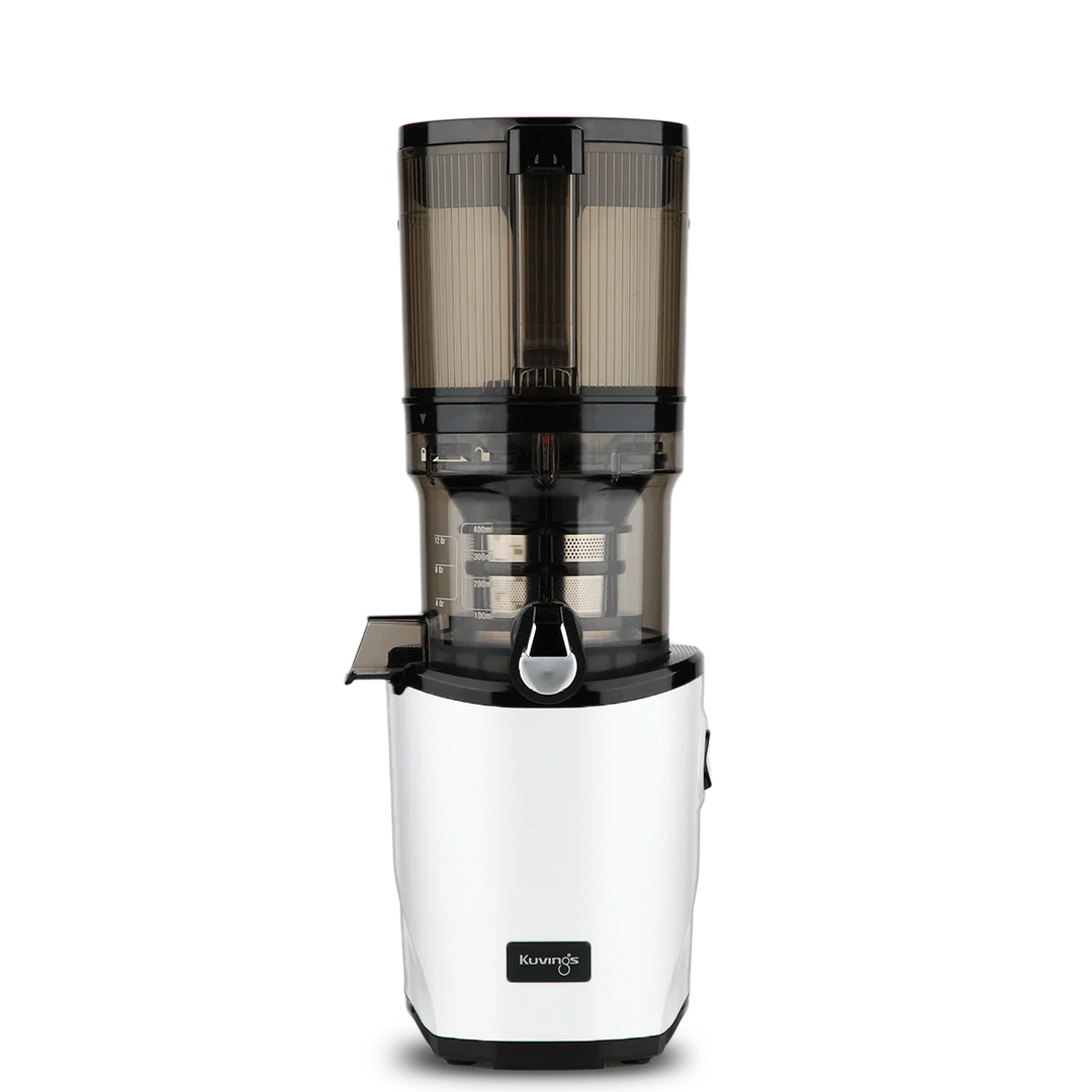 Straight-on studio product shot of a white Kuvings AUTO8 whole slow juicer featuring a large 2000ml transparent grey auto-hopper container assembly, isolated against a transparent grid background.