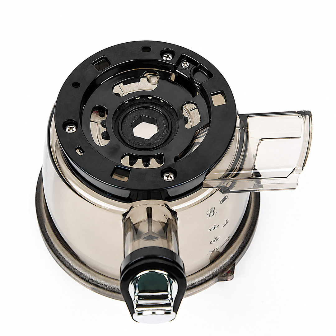 A close-up studio shot of a countertop blender jar assembly, showing the black motor base, clear plastic jar body, and clear pouring spout lid on a white background.